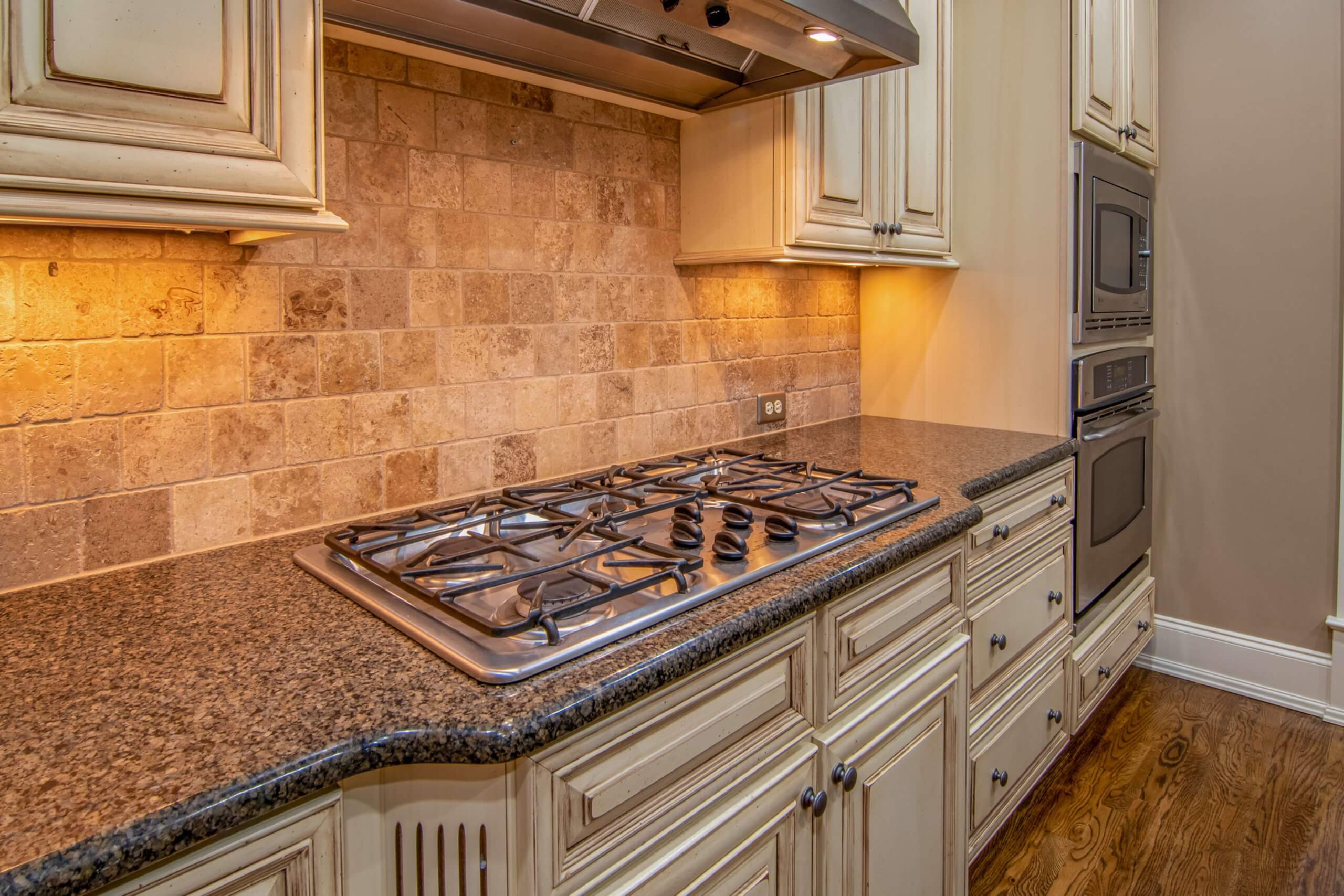 The granite countertops in a kitchen.