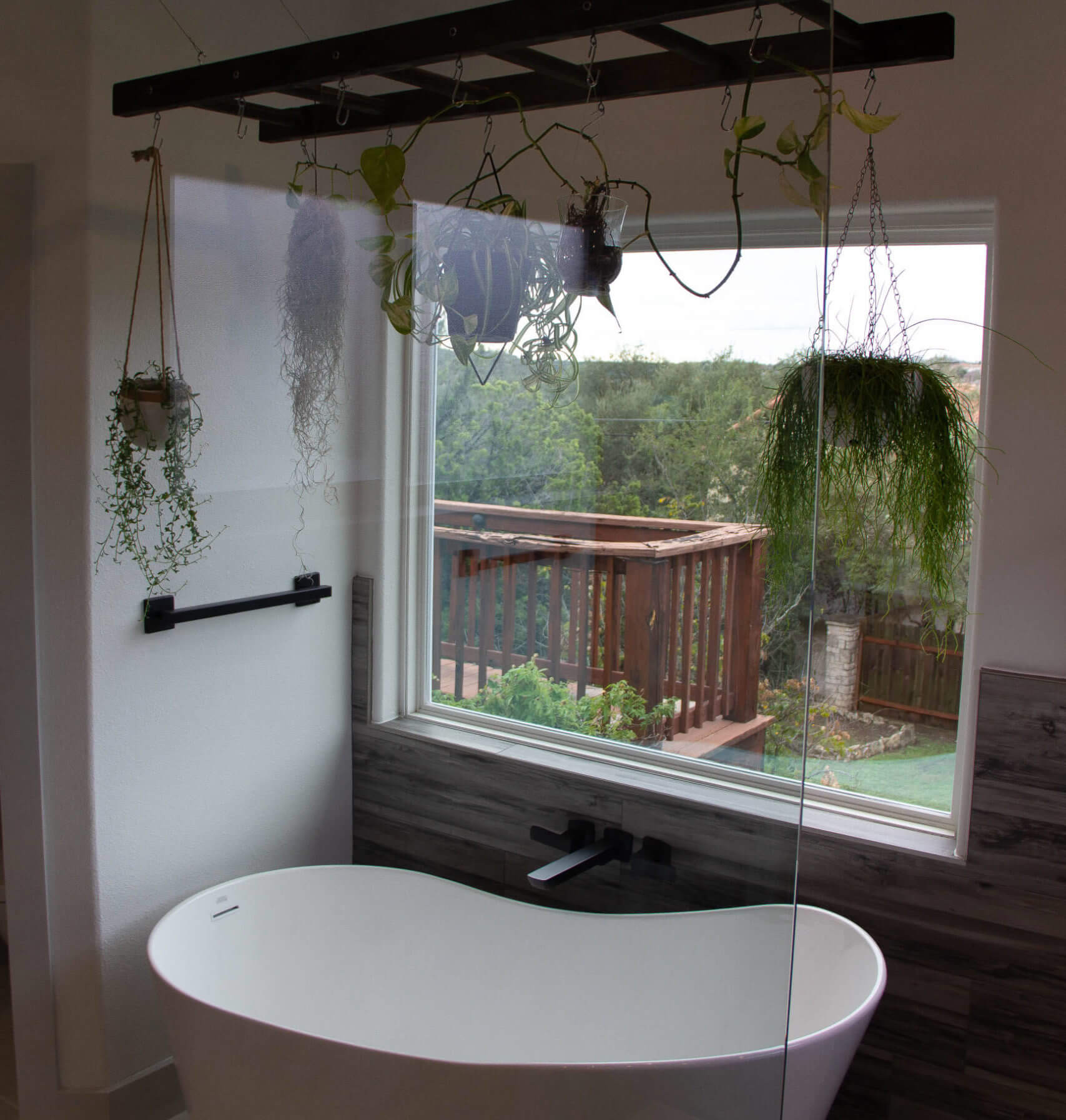 a white bathroom with plants