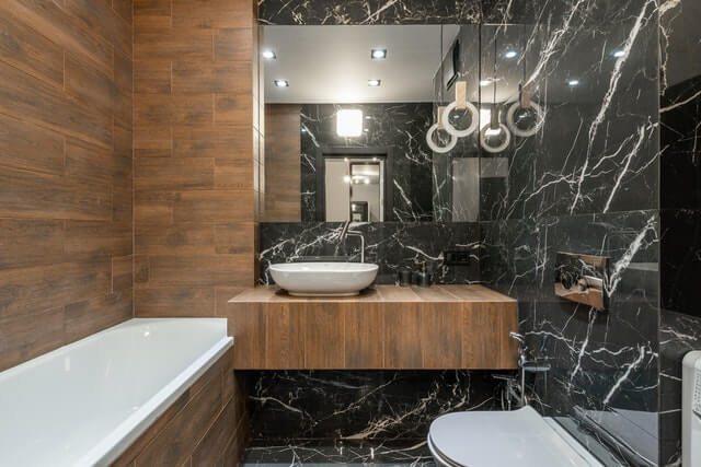a dark bathroom with wood